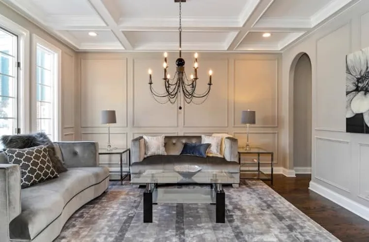 Finished living room with warm gray walls and crisp white trim, painted by Nerto's Painting