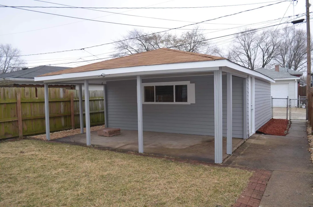 Two-car garage repainted in pewter with clean trim lines